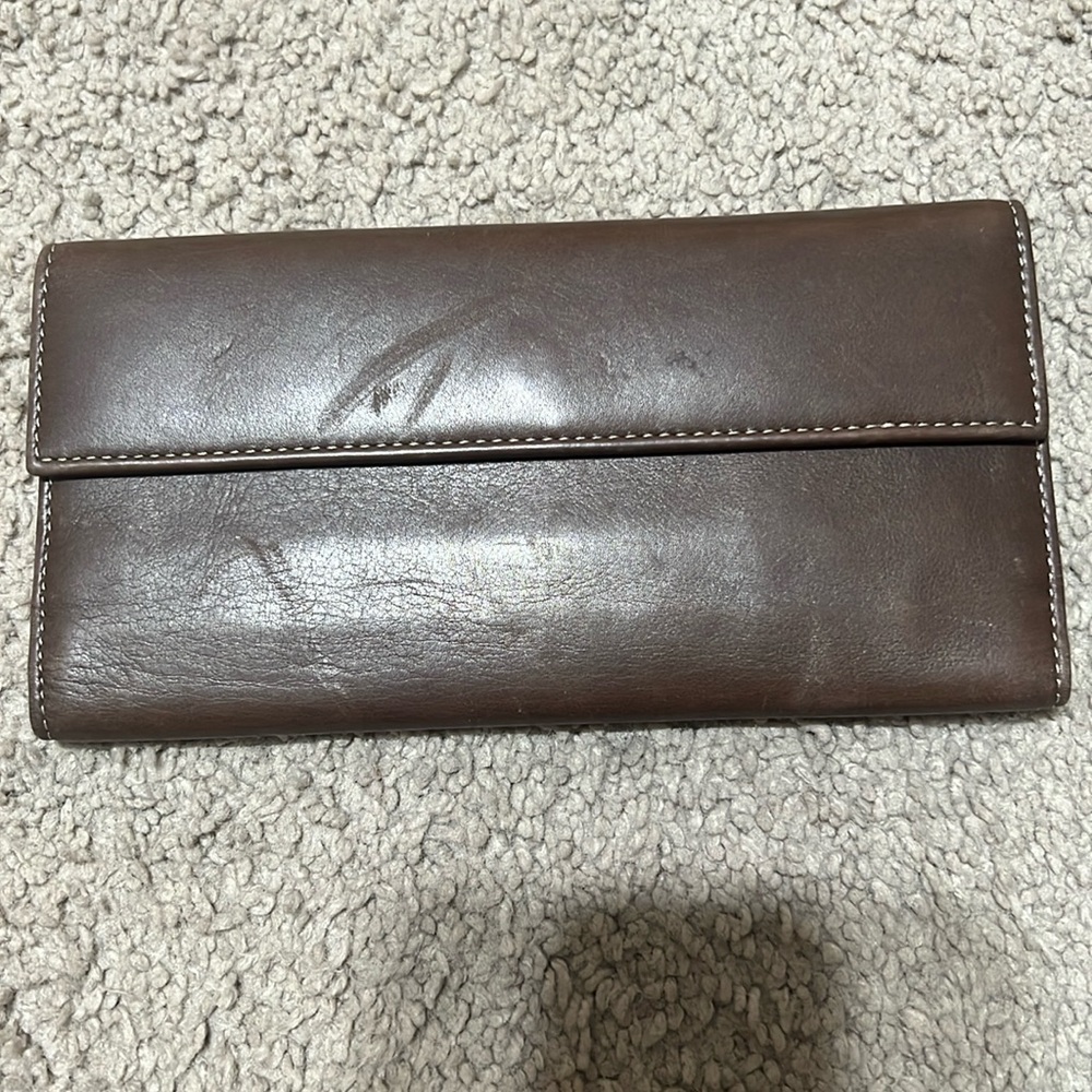 Tusk brown leather wallet. Good used condition